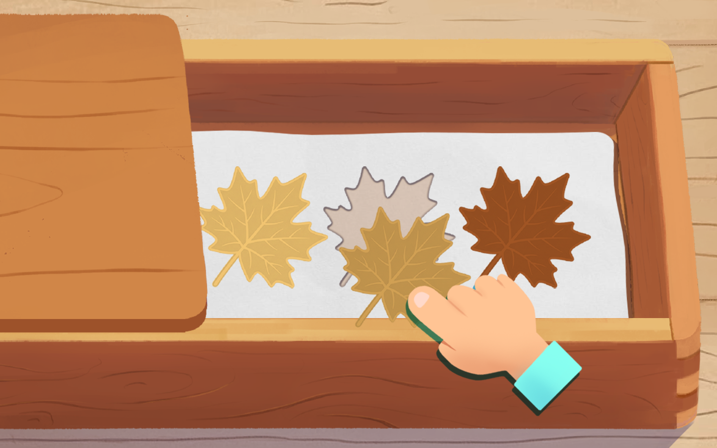 Child sorting green oak leaves from light to dark shades in a wooden box — Nature Box color grading game