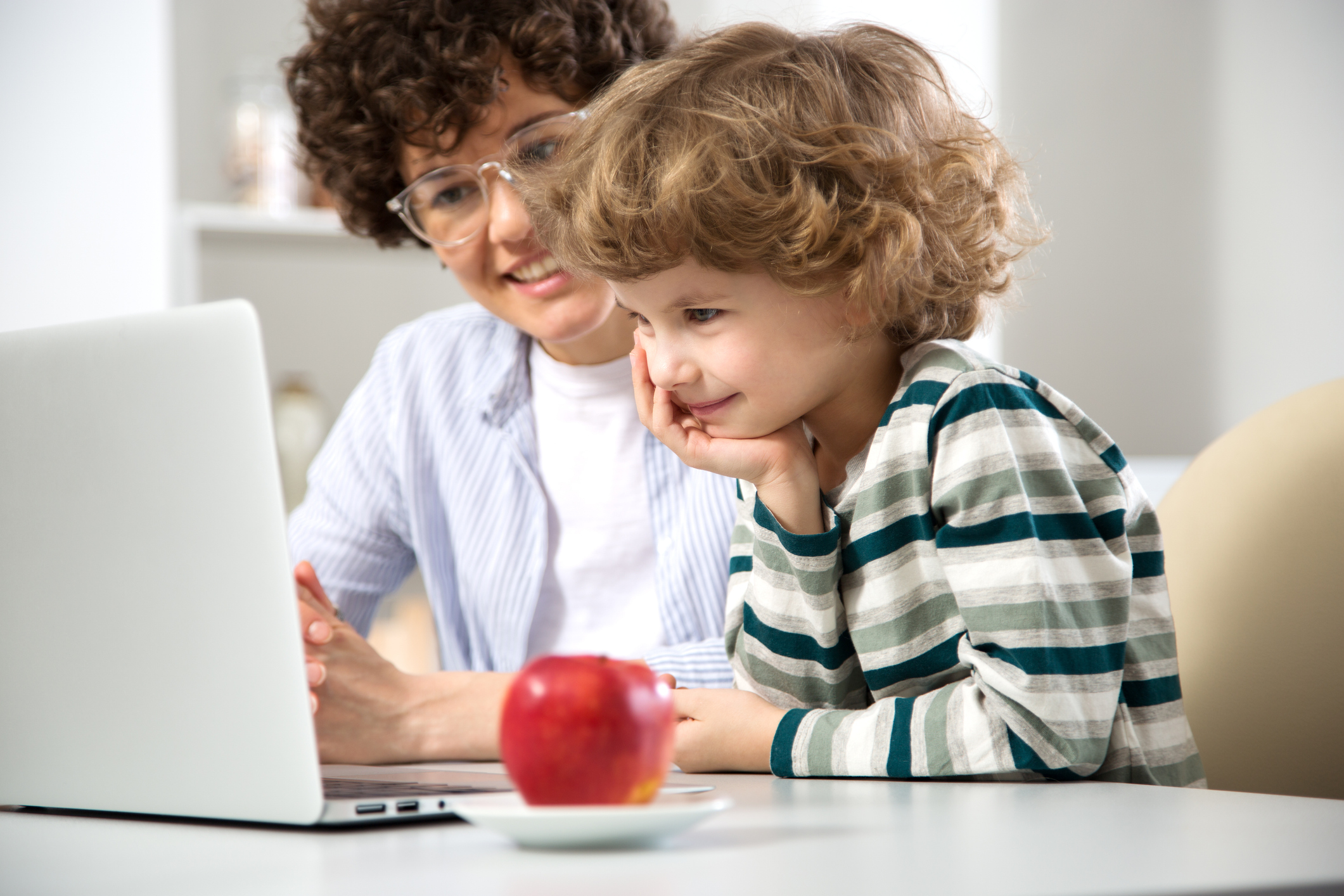 Preschool Teacher Using Educational Technology with Young Child