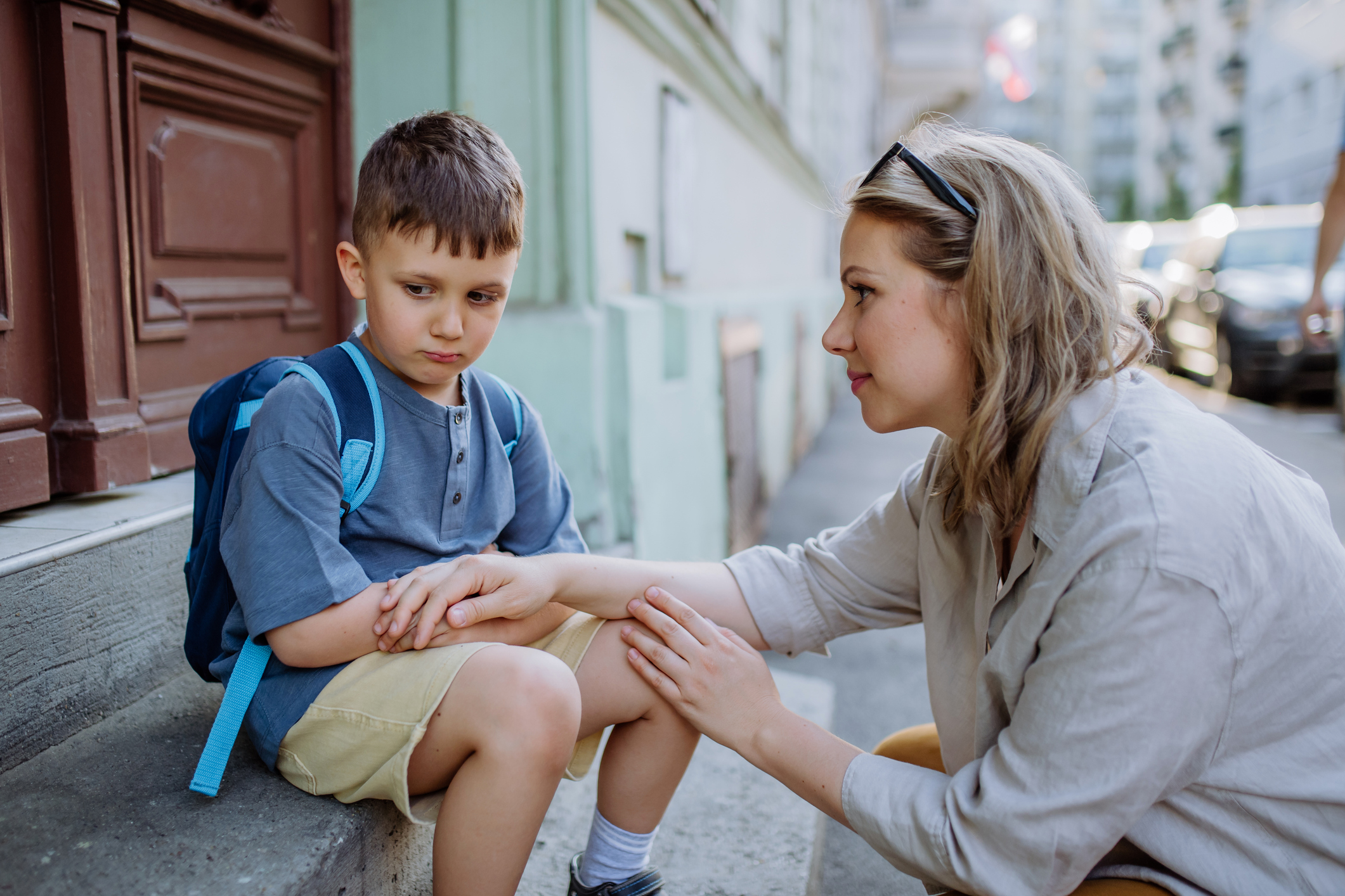 parent comforting an upset child through calm co-regulation and emotional support