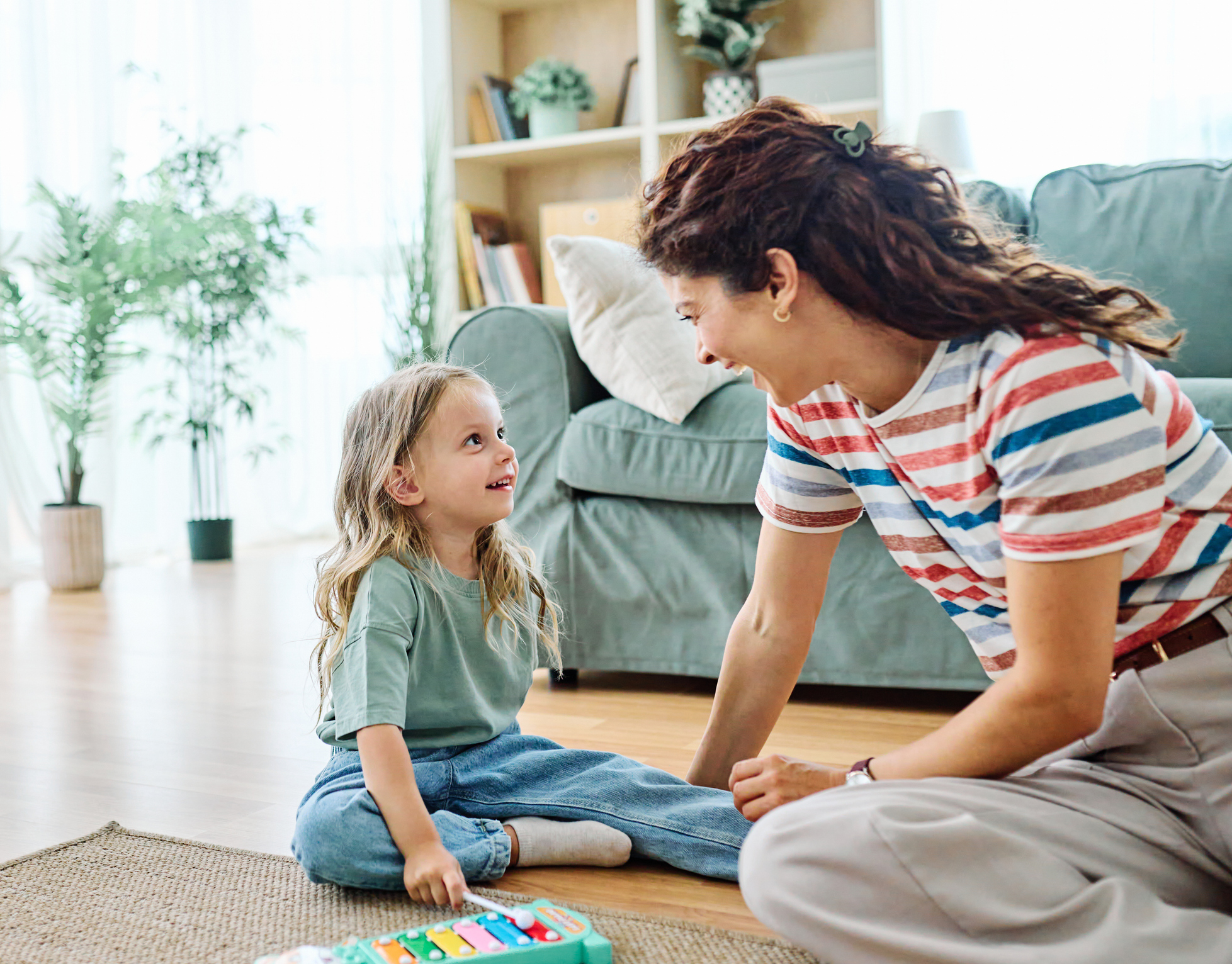 parent calmly responding to a child showing attention-seeking behavior and asking for connection